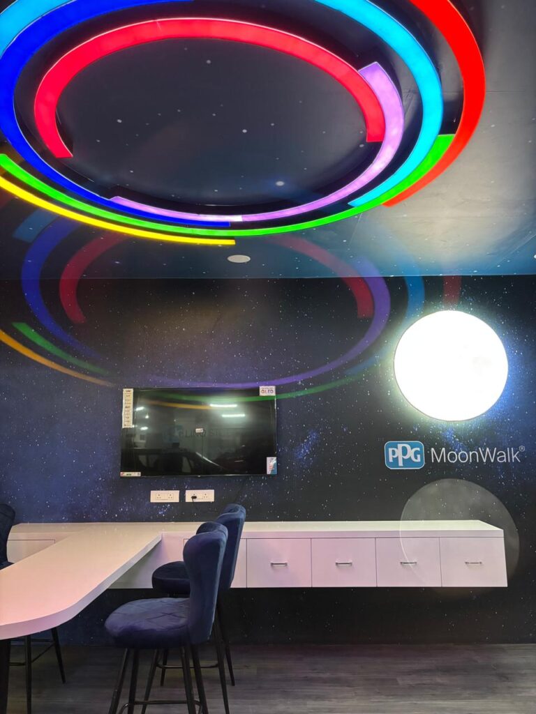 Interior view of PPG Linq retail store showcasing custom layout, finishes, and branding by 4Pz